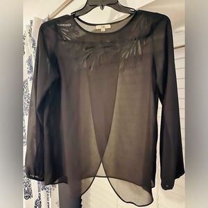 Cute work blouse with cutouts around neckline